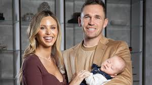 Dr Lynn Burmeister supporting AFL legend Joel Selwood through his IVF journey